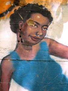 The painter has a nice touch, the shading of the sin tones is nicely done. It appears the woman's blue dress and the man's white pants were added later and much more carelessly. Photo by Carl Swanson