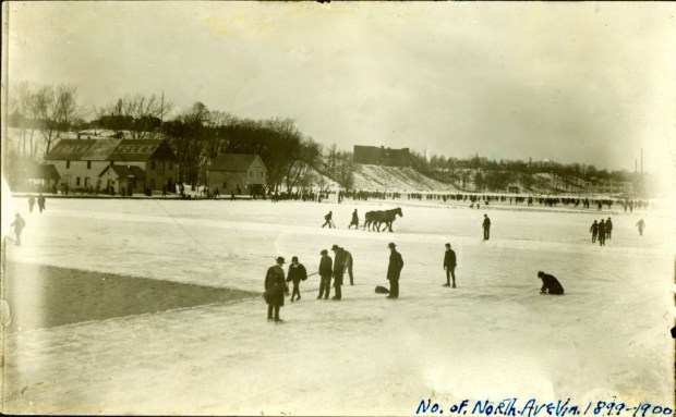 Workers cutting ice from the frozen Milwaukee River upstream of the North Avenue bridge in the winter of 1899-1900. The horse in the background is cutting grooves in the ice in an exact grid. Workers break off the ice and load it into one of seven huge Icehouses located between the North Avenue dam and the foot of East Chambers Street. Courtesy Milwaukee Public Library/Historic Photo Collection