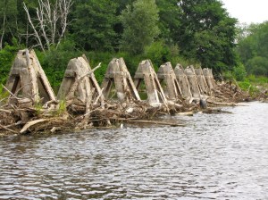 Concrete guards protect the gated portion of the dam from floating logs and ice floes. Photo by Carl Swanson