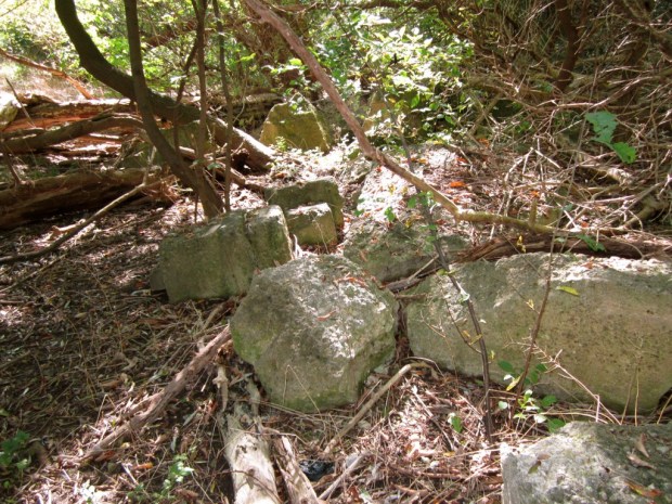 Broken concrete near the Locust Street bridge are all that remains of Random Lake Ice Co. ice house, destroyed in a spectacular blaze 60 years ago. Carl Swanson photo