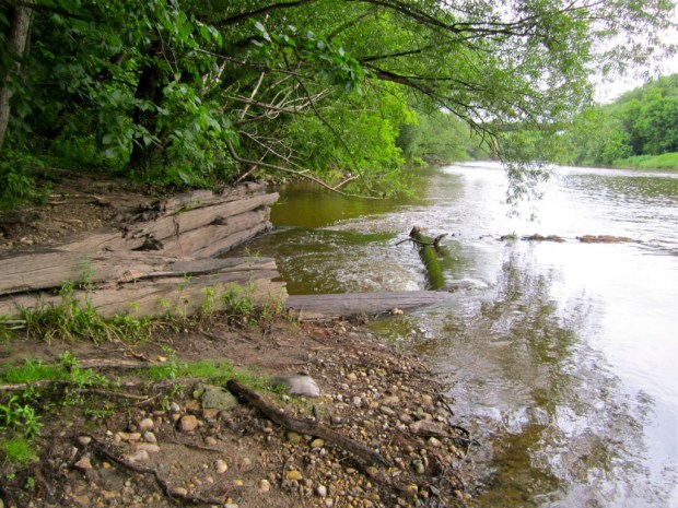 The east end of the Schlitz icehouse dam features this timber spillway, largely intact despite 100 years of floods and freezes. Carl Swanson photo